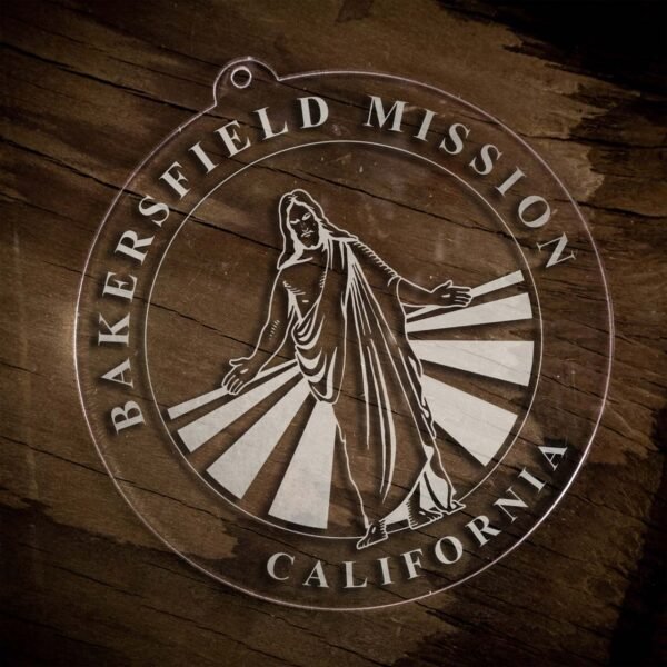LDS California Bakersfield Mission Christmas Ornament laying on a Wooden Background