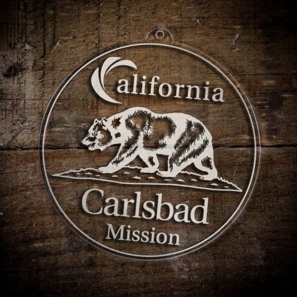 LDS California Carlsbad Mission Christmas Ornament laying on a Wooden Background