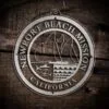 LDS California Newport Beach Mission Christmas Ornament laying on a Wooden Background
