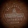 LDS California Sacramento Mission Christmas Ornament laying on a Wooden Background