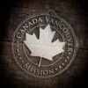 LDS Canada Vancouver Mission Christmas Ornament laying on a Wooden Background