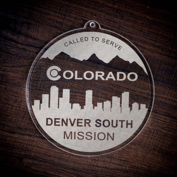 LDS Colorado Denver South Mission Christmas Ornament laying on a Wooden Background