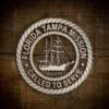 LDS Florida Tampa Mission Christmas Ornament laying on a Wooden Background