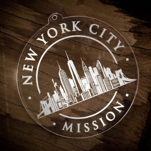 LDS New York New York City Mission Christmas Ornament laying on a Wooden Background