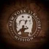 LDS New York Syracuse Mission Christmas Ornament laying on a Wooden Background
