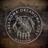 LDS Oklahoma Oklahoma City Mission Christmas Ornament laying on a Wooden Background