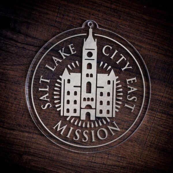 LDS Utah Salt Lake City East Mission Christmas Ornament laying on a Wooden Background