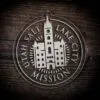 LDS Utah Salt Lake City Mission Christmas Ornament laying on a Wooden Background