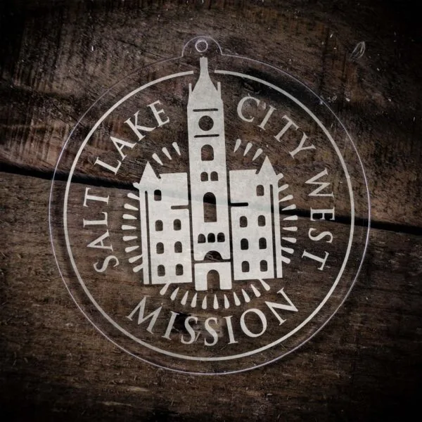 LDS Utah Salt Lake City West Mission Christmas Ornament laying on a Wooden Background