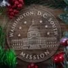 D.C. South Mission Christmas Ornament laying on a Wooden Background