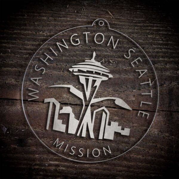 LDS Washington Seattle Mission Christmas Ornament laying on a Wooden Background