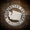 LDS Washington Yakima Mission Christmas Ornament laying on a Wooden Background