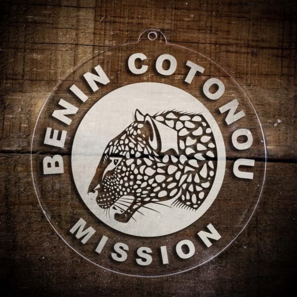 LDS Benin Cotonou Mission Christmas Ornament laying on a Wooden Background