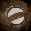 LDS Cameroon Yaounde Mission Christmas Ornament laying on a Wooden Background