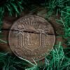 LDS Côte d'Ivoire Yamoussoukro Mission Christmas Ornament surrounded by a Simple Reef