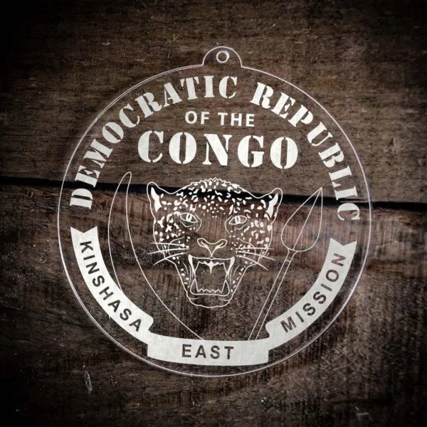 LDS Democratic Republic of the Congo Kinshasa East Mission Christmas Ornament laying on a Wooden Background