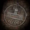 LDS England Leeds Mission Christmas Ornament laying on a Wooden Background