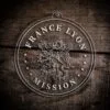 LDS France Lyon Mission Christmas Ornament laying on a Wooden Background