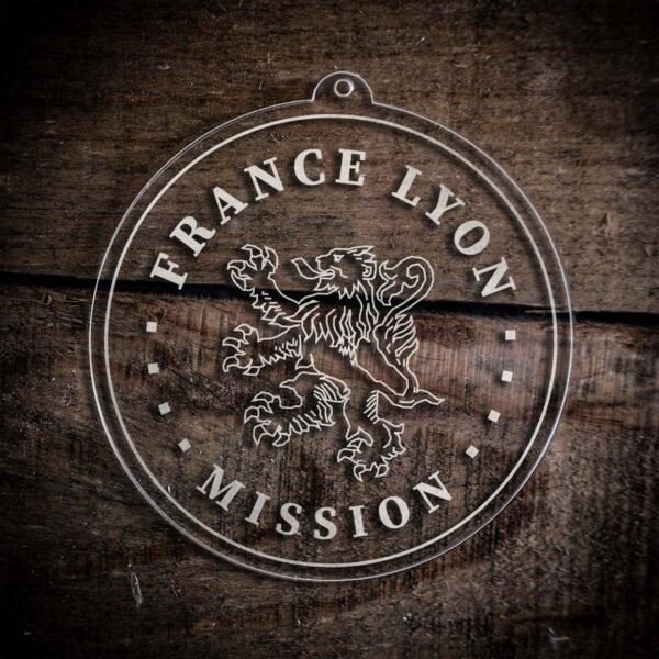 LDS France Lyon Mission Christmas Ornament laying on a Wooden Background