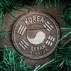 LDS Korea Busan Mission Christmas Ornament surrounded by a Simple Reef