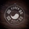LDS Korea Busan Mission Christmas Ornament laying on a Wooden Background