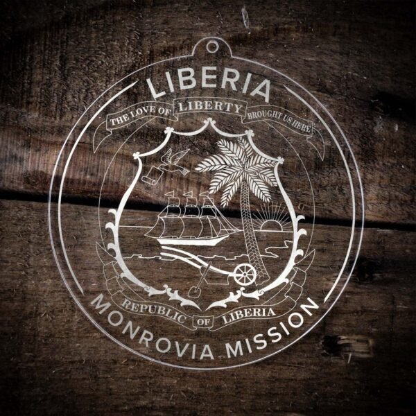 LDS Liberia Monrovia Mission Christmas Ornament laying on a Wooden Background
