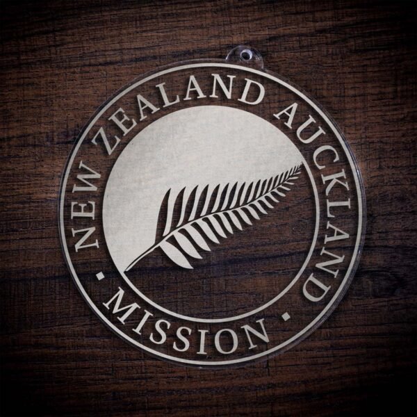 LDS New Zealand Auckland Mission Christmas Ornament laying on a Wooden Background