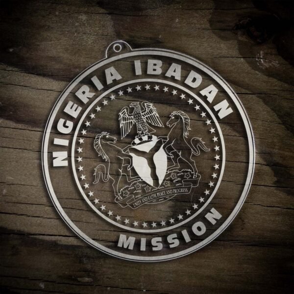 LDS Nigeria Ibadan Mission Christmas Ornament laying on a Wooden Background