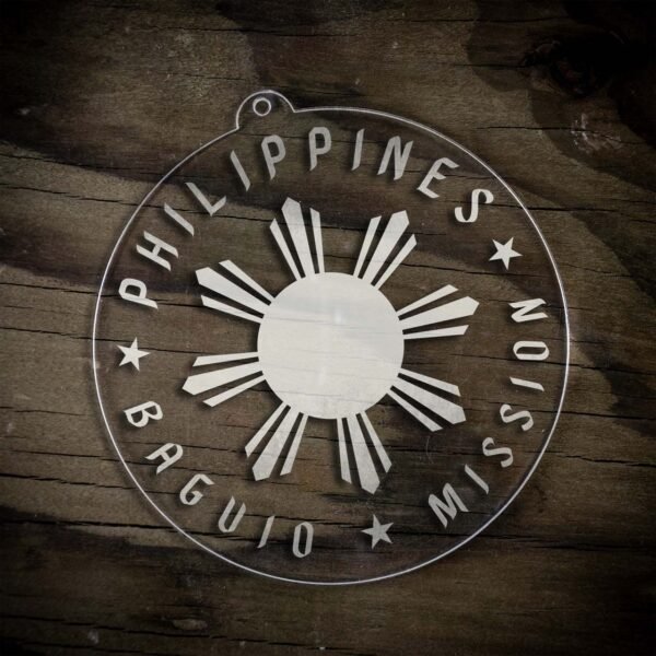LDS Philippines Baguio Mission Christmas Ornament laying on a Wooden Background