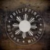 LDS Philippines Butuan Mission Christmas Ornament laying on a Wooden Background