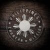 LDS Philippines Cauayan Mission Christmas Ornament laying on a Wooden Background