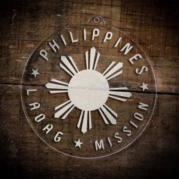 LDS Philippines Laoag Mission Christmas Ornament laying on a Wooden Background