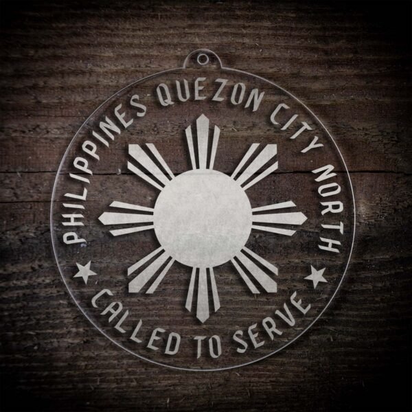 LDS Philippines Quezon City North Mission Christmas Ornament laying on a Wooden Background
