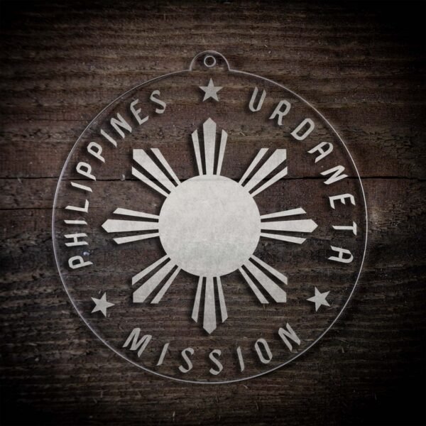 LDS Philippines Urdaneta Mission Christmas Ornament laying on a Wooden Background