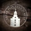 LDS Cedar City Utah Temple Christmas Ornament laying on a Wooden Background
