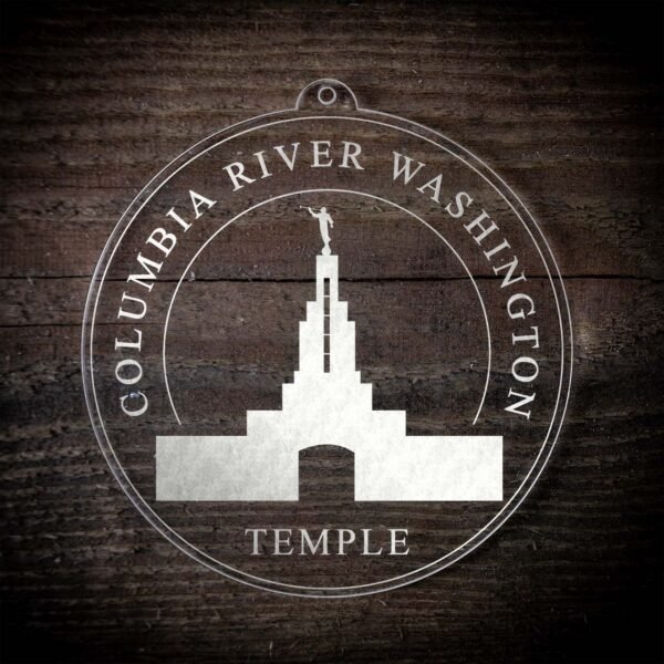 LDS Columbia River Washington Temple Christmas Ornament laying on a Wooden Background