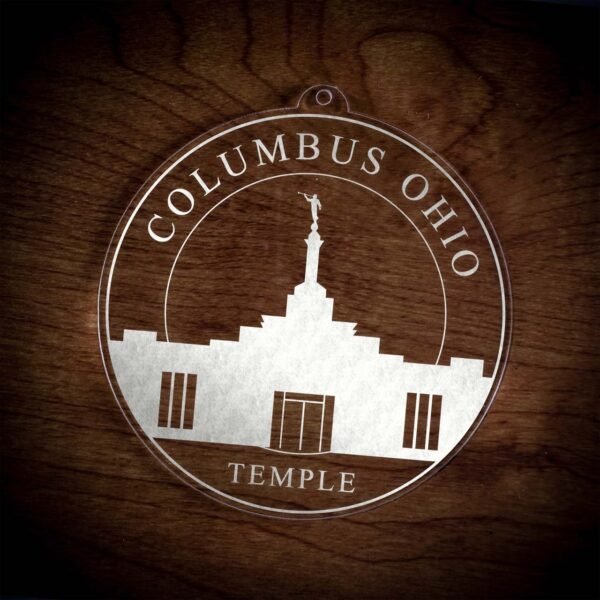 LDS Columbus Ohio Temple Christmas Ornament laying on a Wooden Background