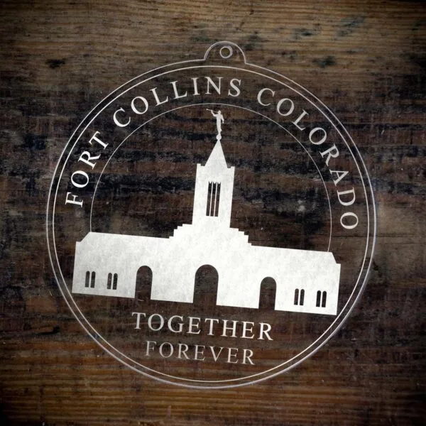 LDS Fort Collins Colorado Temple Christmas Ornament laying on a Wooden Background