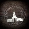 LDS Hartford Connecticut Temple Christmas Ornament laying on a Wooden Background