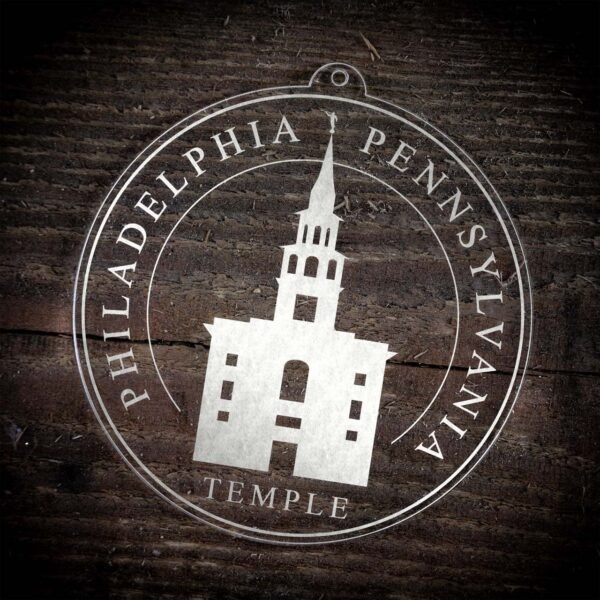 LDS Philadelphia Pennsylvania Temple Christmas Ornament laying on a Wooden Background