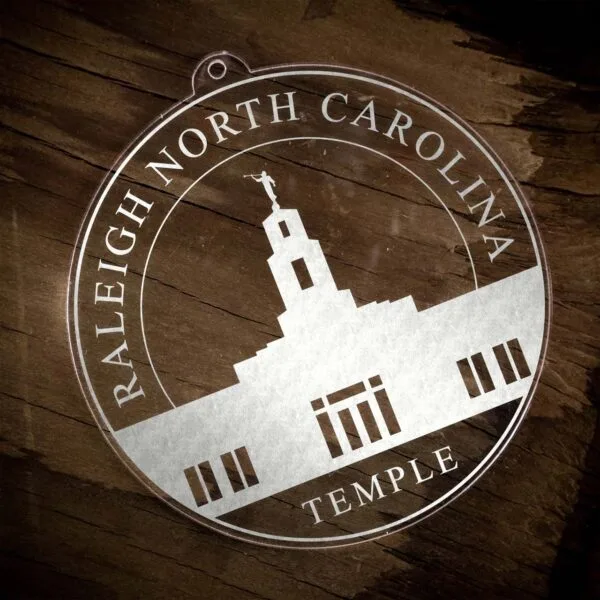 LDS Raleigh North Carolina Temple Christmas Ornament laying on a Wooden Background