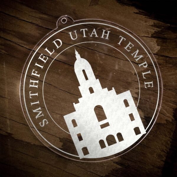 LDS Smithfield Utah Temple Christmas Ornament laying on a Wooden Background