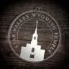 LDS Star Valley Wyoming Temple Christmas Ornament laying on a Wooden Background