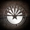 LDS Arizona Flagstaff Mission Christmas Ornament laying on a Wooden Background