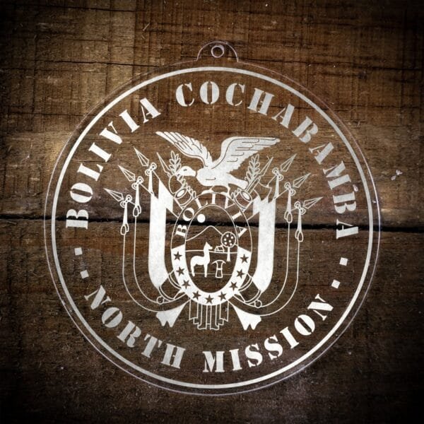 LDS Bolivia Cochabamba North Mission Christmas Ornament laying on a Wooden Background