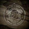 LDS Cote d'Ivoire Abidjan East Mission Christmas Ornament laying on a Wooden Background