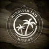LDS Hawaii Laie Mission Christmas Ornament laying on a Wooden Background