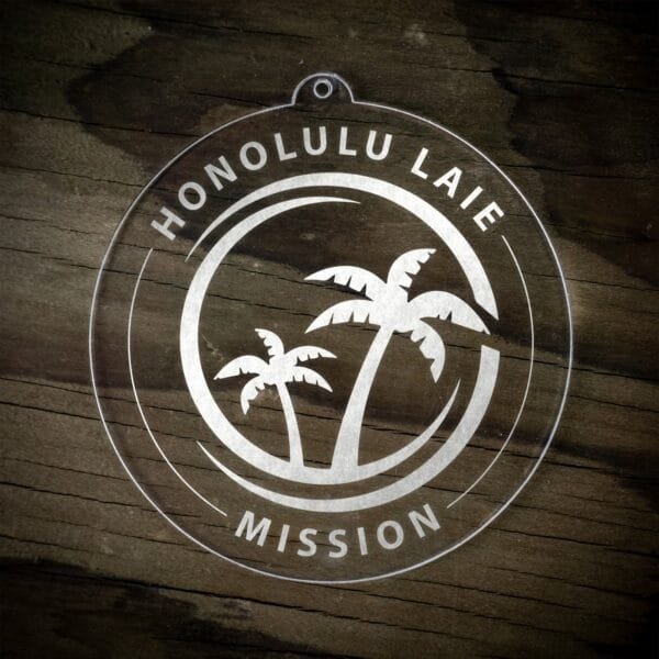 LDS Hawaii Laie Mission Christmas Ornament laying on a Wooden Background