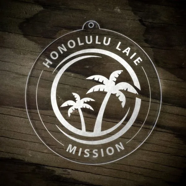 LDS Hawaii Laie Mission Christmas Ornament laying on a Wooden Background