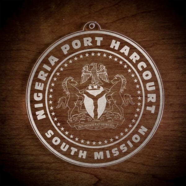 LDS Nigeria Port Harcourt South Mission Christmas Ornament laying on a Wooden Background